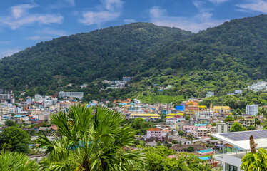 view of Patong and Patong Beach from the mountains colourful skies at Sunset. Patong is a vibrant city full of tourists from all around the world. 