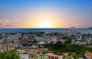 view of Patong and Patong Beach from the mountains colourful skies at Sunset. Patong is a vibrant city full of tourists from all around the world. 
