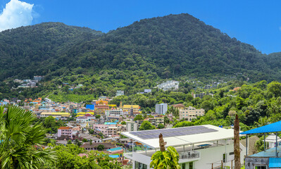 view of Patong and Patong Beach from the mountains colourful skies at Sunset. Patong is a vibrant...