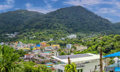 view of Patong and Patong Beach from the mountains colourful skies at Sunset. Patong is a vibrant...