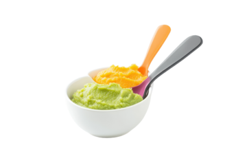 Colorful baby food puree in a white bowl with spoons ready for feeding during mealtime preparation