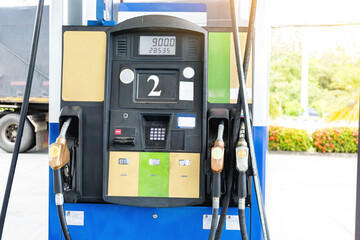 Transportation and ownership concept - man pumping gasoline fuel in car at gas station. hight price during war Russia and  Ukraine Israel Iran Hamas concept.