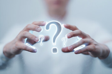 Hands holding glowing question marks isolated on white background