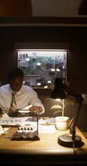 The detective puts the crime photos on the board. The process of solving a crime
