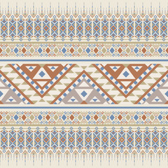 Colorful tribal pattern in soft blue and brown. Ethnic inspired stripes and triangle motifs in seamless vector layout.