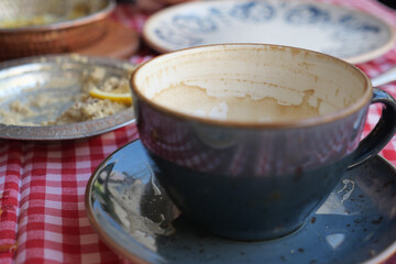 Coffee cup after a delightful meal outdoors