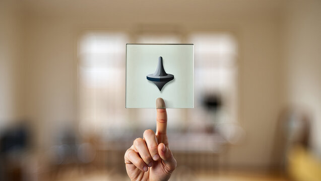 A Hand Interacts with a Transparent Spinning Top Icon on a Sleek Interface, Suggesting Playfulness and Nostalgia Against a Softly Blurred Interior Backdrop