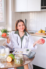 A nutritionist demonstrates a donut as an example of unhealthy food and its effect on weight and...