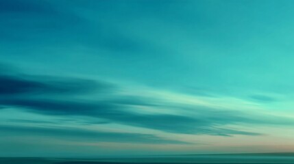 Fototapeta premium An ethereal turquoise sky evokes a feeling of tranquility and peace at the tranquil dawn horizon.