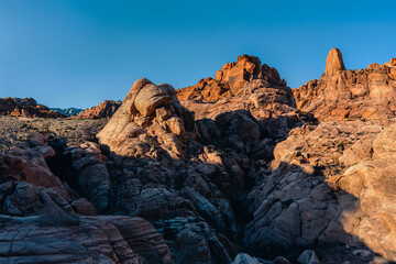 Red rock canyon nevadas sandstone cliffs display dramatic sunlit formations.