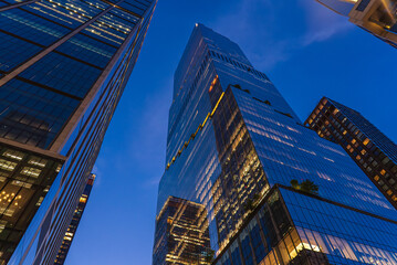 Modern buildings in the city of New York at nightfall.