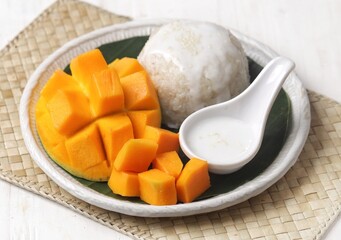 Mango sticky rice is a Thai dessert made from sticky rice, mango and coconut milk.