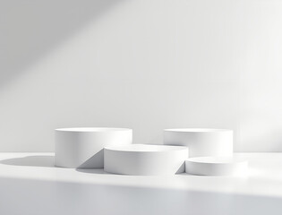 White cylindrical podiums with shadows on a white surface for product display or presentation