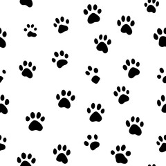 Seamless pattern of black and white dog paw prints