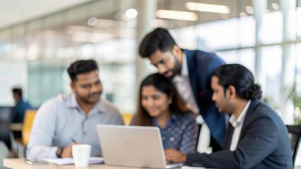 Indian executives collaborating on digital marketing strategy in modern workspace
