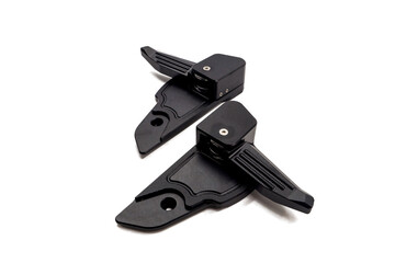 pair of motorcycle footstep parts isolated on white background, motorcycle foot peg