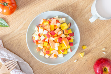 A close-up of Fresh fruit and vegetable salad.