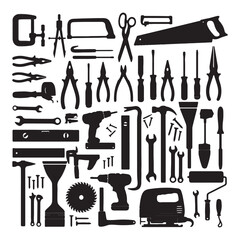Various black workshop tools and hardware arranged in a pattern construction