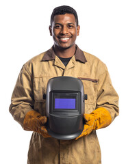 A smiling welder holding a welding helmet, showcasing his expertise and craftsmanship. He is in a brown work uniform and yellow work gloves