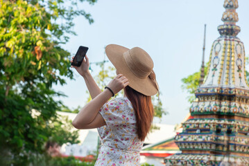 Traveler tourist enjoy walking to see the historic park of Thailand exciting to explore the...