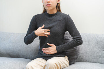 Acid reflux disease, suffer asian young woman have symptom gastroesophageal, esophageal, stomach...