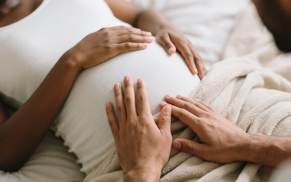 Close-Up of Partner Holding Pregnant Woman’s Hand – Emotional Connection