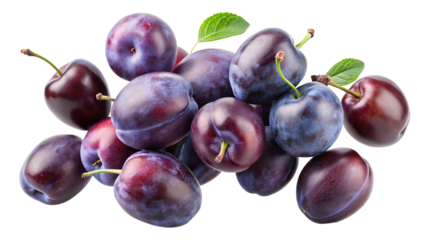 A pile of fresh plums with vibrant colors and leafy green accents