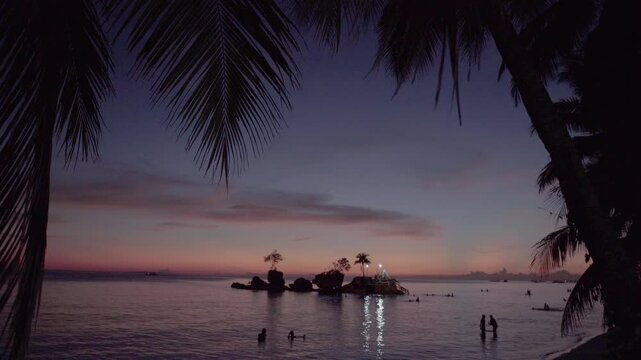 Willy Rock is a tidal island with a statue of the Virgin Mary at the Boracay beach in Philippines