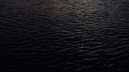 Closeup footage of ocean water surface during dawn