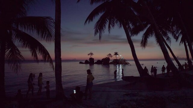 Willy Rock is a tidal island with a statue of the Virgin Mary at the Boracay beach in Philippines