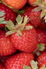 Fresh Juicy Strawberries Piled Together Highlighting Vibrant Red and Green Coloring