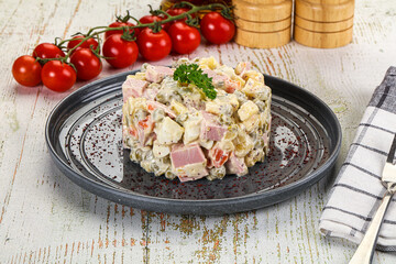 Russian traditional Olivier salad with sausages
