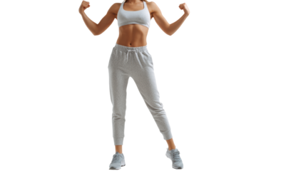 Fit young woman showing strength with a confident pose, isolated on a white background.