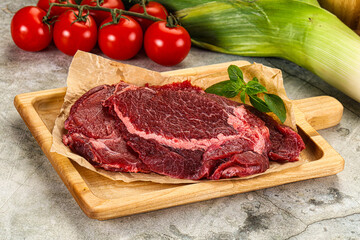 Raw beef cheeks cut for cooking