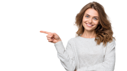 Smiling woman in gray sweater pointing to the side, isolated on a white background.