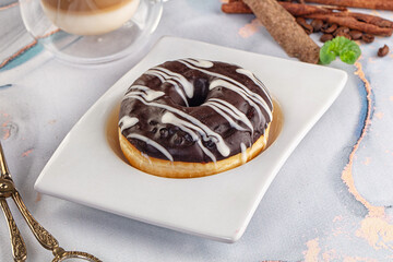 Delicous sweet donut with chocolate glaze