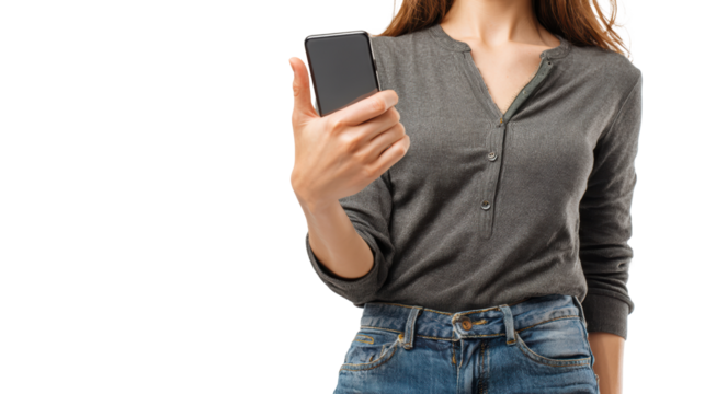 Woman holding smartphone, casual attire, against white isolate background.