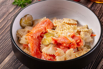 Italian pasta farfalle with salmon