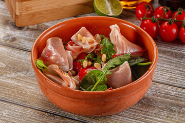 Salad with jamon, strawberry and arugula