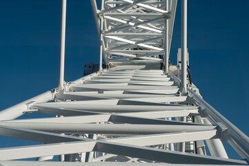Captivating perspective of a towering structure reaching into a vivid blue sky