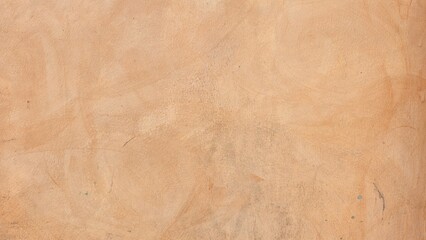 Orange painted cement wall, unevenly painted wall, texture of old wall.