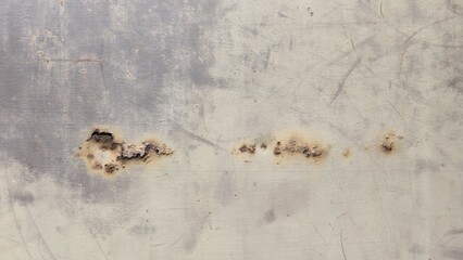 Rust stains on iron sheet, old faded iron sheet, stains and floats, texture background image.