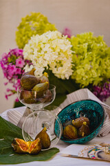 Juicy figs in a ceramic bowl on a wooden table - still life with natural light