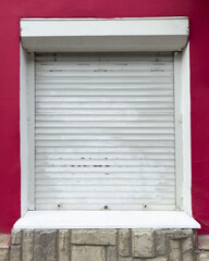 A white door with a red wall behind it