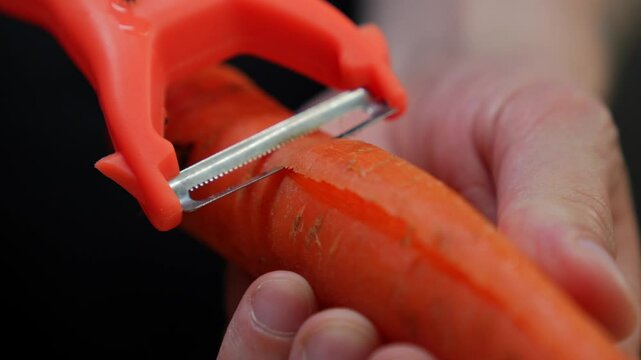 Knife for peeling vegetables.
A chef uses a vegetable peeler to peel a carrot before cooking.
A sharp knife for cutting vegetables.