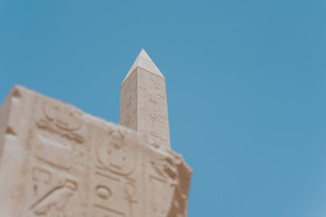 Karnak temple obelisk reaching for the vibrant blue sky