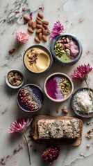 Overhead shot of clean eating essentials, colorful smoothie bowls, almond butter toast, raw nuts, edible flowers