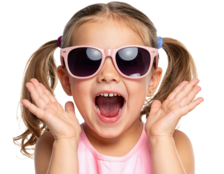 A young girl with pigtails wearing large pink sunglasses, smiling widely with her mouth open and hands raised near her face.