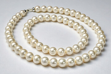 Elegant pearl necklace isolated on white background