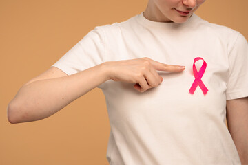 Woman Wearing Pink Ribbon for Breast Cancer Awareness